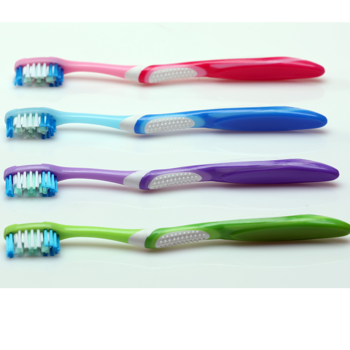 Oraline 000-16890 Premium Compact Whitening Toothbrush - 32 Tuft Soft Bristle Toothbrush with Power Tip & Elastomer Grip Handle (144/Case)